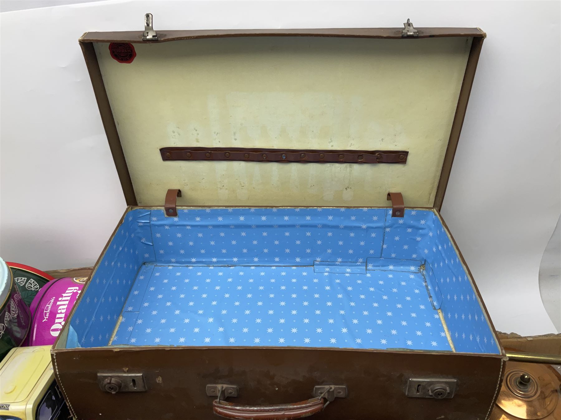 Collection of silver plated cased cutlery including part canteens and butter knives, together with other metal ware including J&J Siddons iron, horse brasses and a copper kettle, 1970s children's annuals including Beano, two handbags and three suitcases, vintage tins etc, in four boxes 