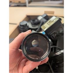 Collection of camera lenses, including Tamron, Praktica, Minolta and Soligor examples