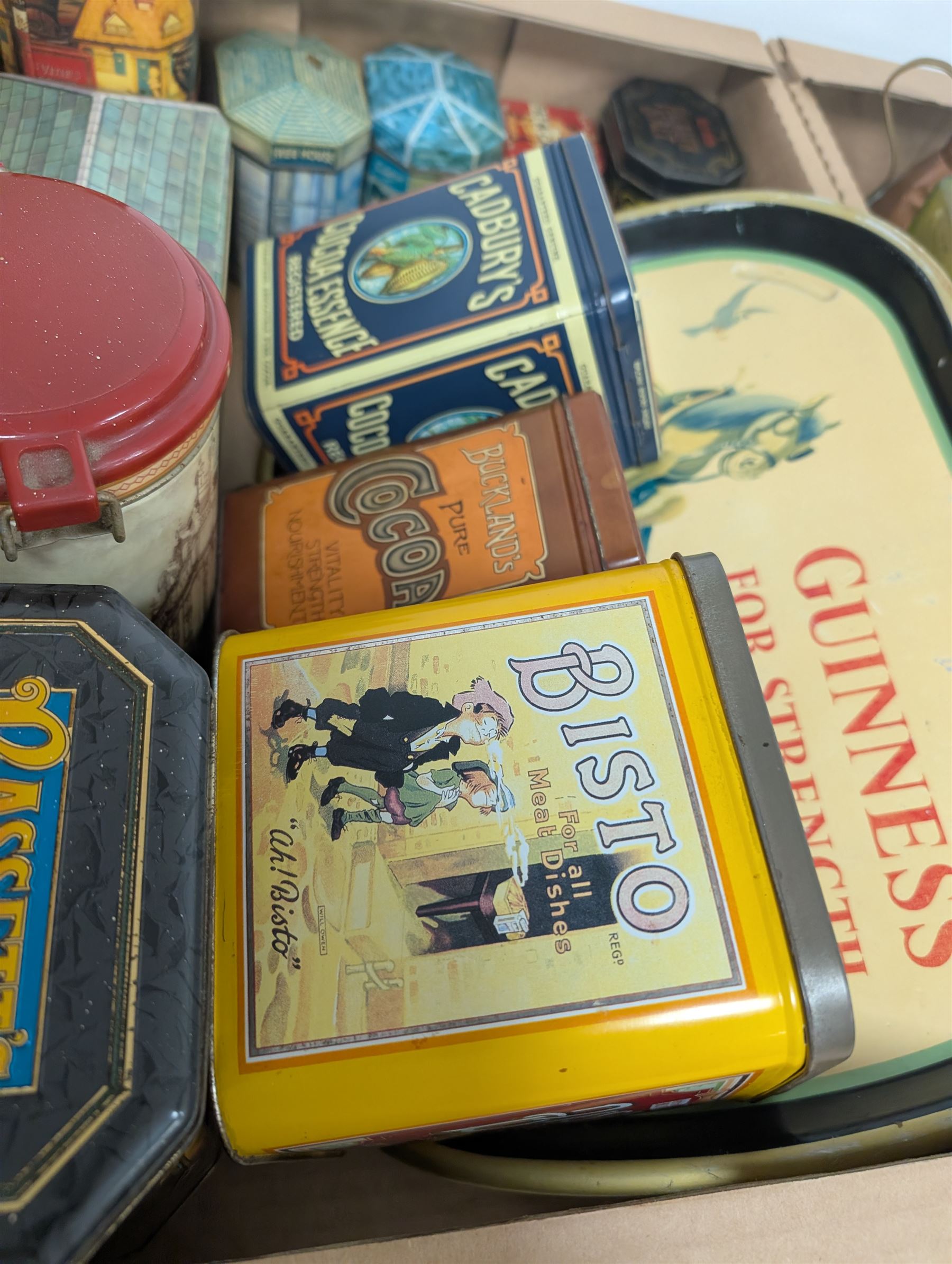 Collection of advertising tins, including Bisto and Cadburys, together with a Guinness 'For Strength' metal tray, brass measures, glass bottles, Royal Crown Derby cat paperweight, etc