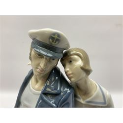 Lladro figure, Sailors Serenade, modelled as a sailor playing an accordion with a woman seated upon a crate, no 5276, year issued 1985, year retired 1988, H32cm