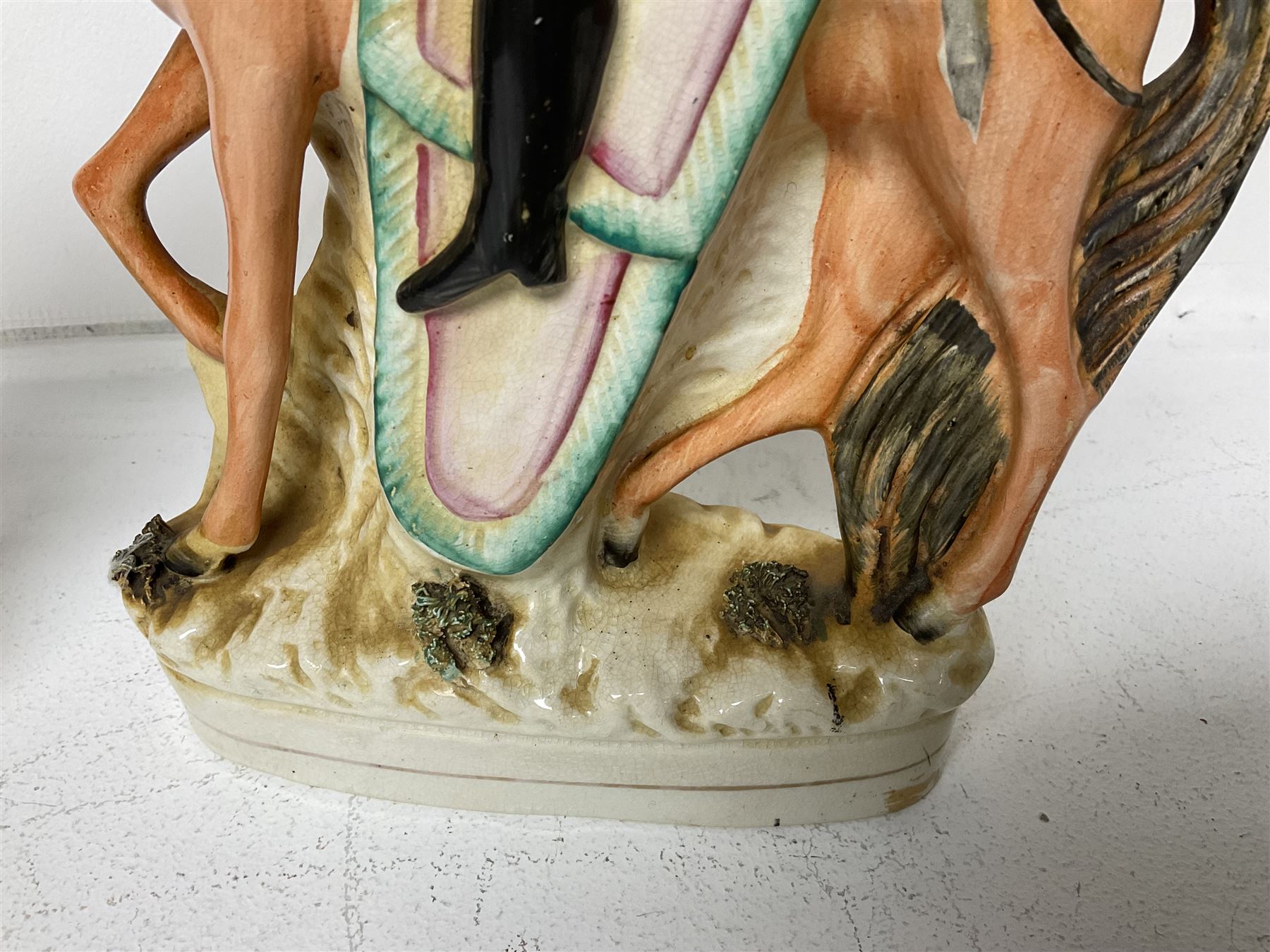 Staffordshire figure of the Duke of Wellington on a bay horse, H30cm in red uniform, together with a similar Staffordshire figure of Dick Turpin, pair of Staffordshire style dogs, H27cm, three Meissen style double salts and two trinket boxes 