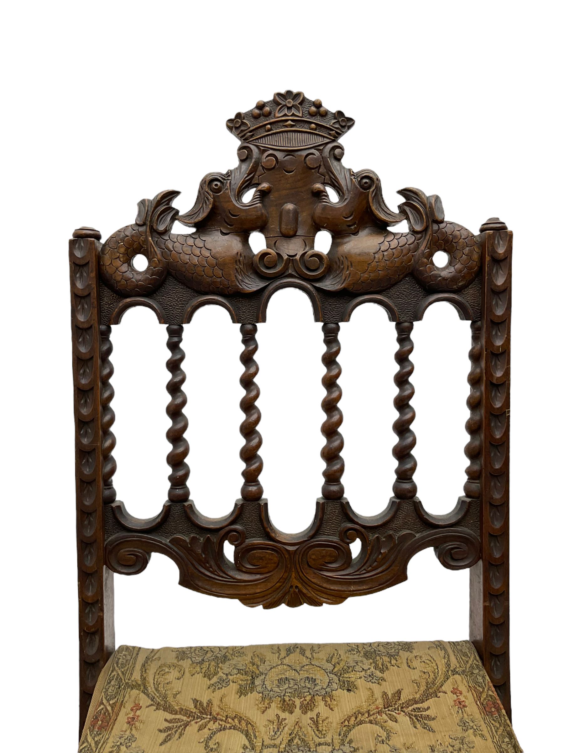 19th century carved mahogany folding chair, cresting rail carved with two stylised fish flanking a crown, spiral turned spindle supports over tapestry seat (W37cm H89); and another folding chair (W46cm H100cm)