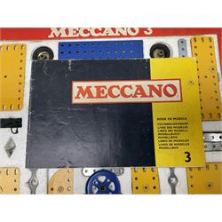 Meccano - Outfits 2, 3 & 4 with blue and yellow parts; look to be virtually complete with most apertures filled; together with a partially stocked Meccano Elekrikit; all boxed with instruction manuals (4)