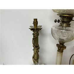 Oil lamp with frosted floral shade and cut glass reservoir, upon cast brass and marble base, together with a cast brass Corinthian column table lamp, pair of brass table lamps and a composite metal figure of a violinist 