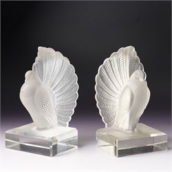 Pair of frosted glass peacock bookends, in the style of Lalique, on clear bases with bevel...