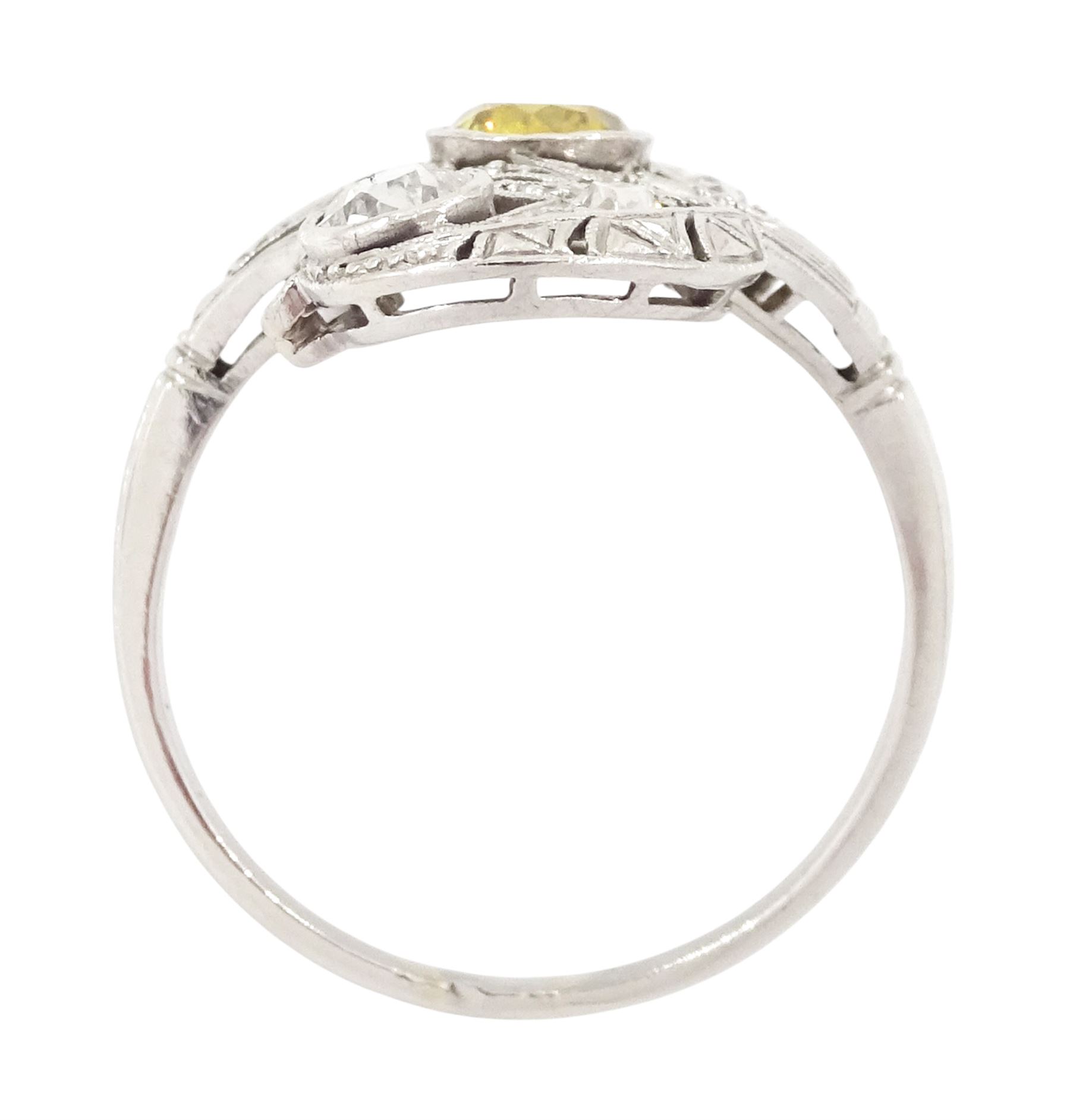 Early 20th century platinum diamond swirl ring, the principal old cut fancy yellow diamond of approx 0.50 carat, surrounded by old cut and single cut diamonds, in a milgrain pierced foliate design setting, total diamond weight approx 1.25 carat, with GCS certificate