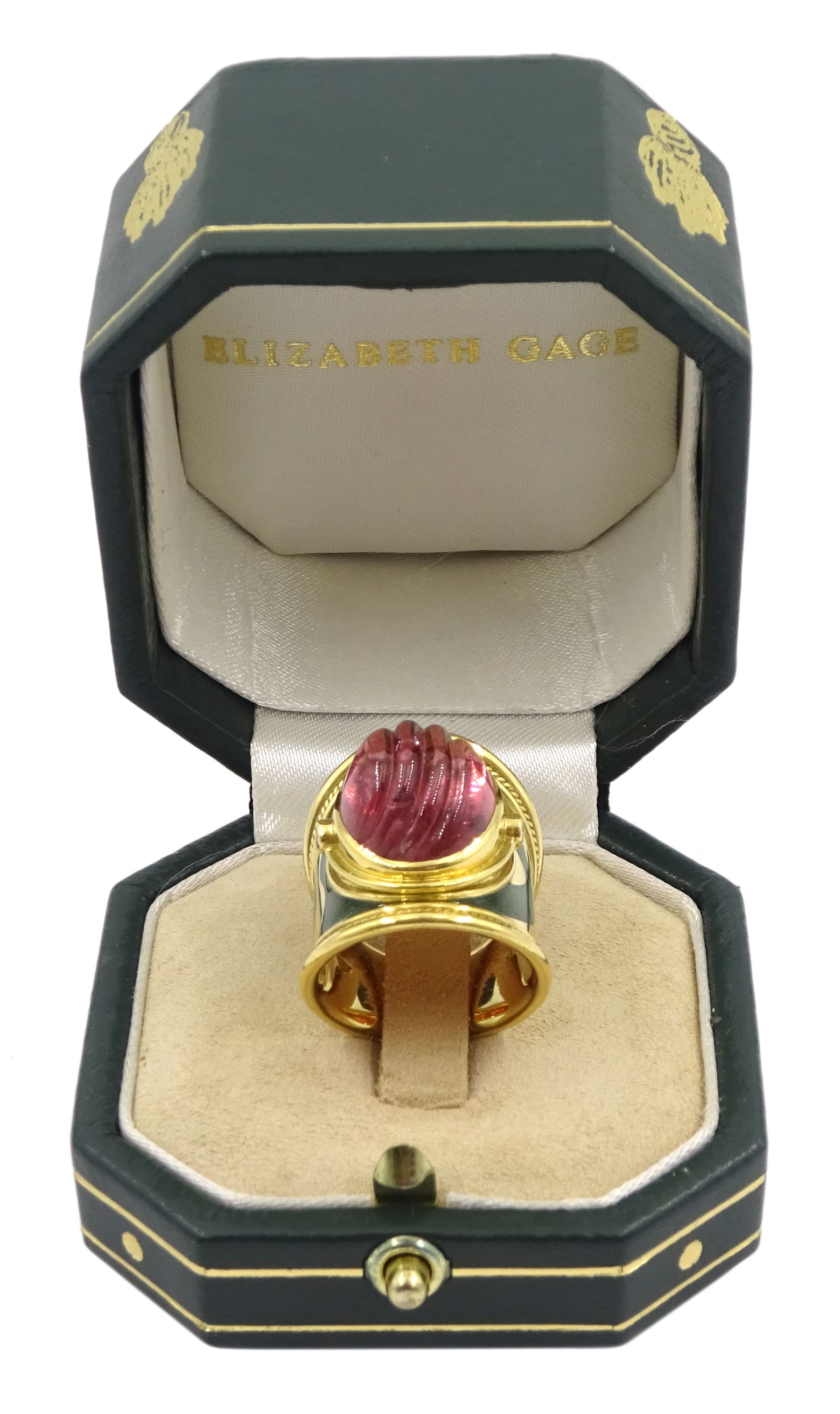 Elizabeth Gage 18ct gold tourmaline and diamond tapered Templar ring, the carved oval pink tourmaline cabochon with a round brilliant cut diamond set either side, the band featuring green guilloche enamel and the edges finished with wire-twist-wire decoration, London 1994, in original box