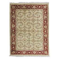Baluchi signed hand-knotted rug, ivory ground, with an all-over geometric lattice design i...