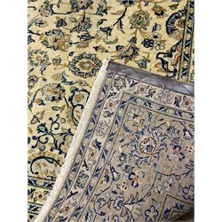 Central Persian Kashan carpet, decorated all-over with interlacing floral design, scrolling border with stylised plant motifs, with signed panel