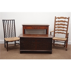  19th century oak blanket box with carved front (W92cm, H46cm, D40cm), an early 19th century oak side table with single drawer and two rush seat chairs  