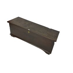 18th century oak sword chest or coffer, hinged lid with moulded edge and iron fittings concealing candle box and main compartment, the front with studwork spelling 'TC 1750', raised on bracket feet