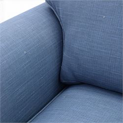 Contemporary blue small sofa bed, shaped arms with loose seat cushions, stowed bed beneath, raised on light wood feet
