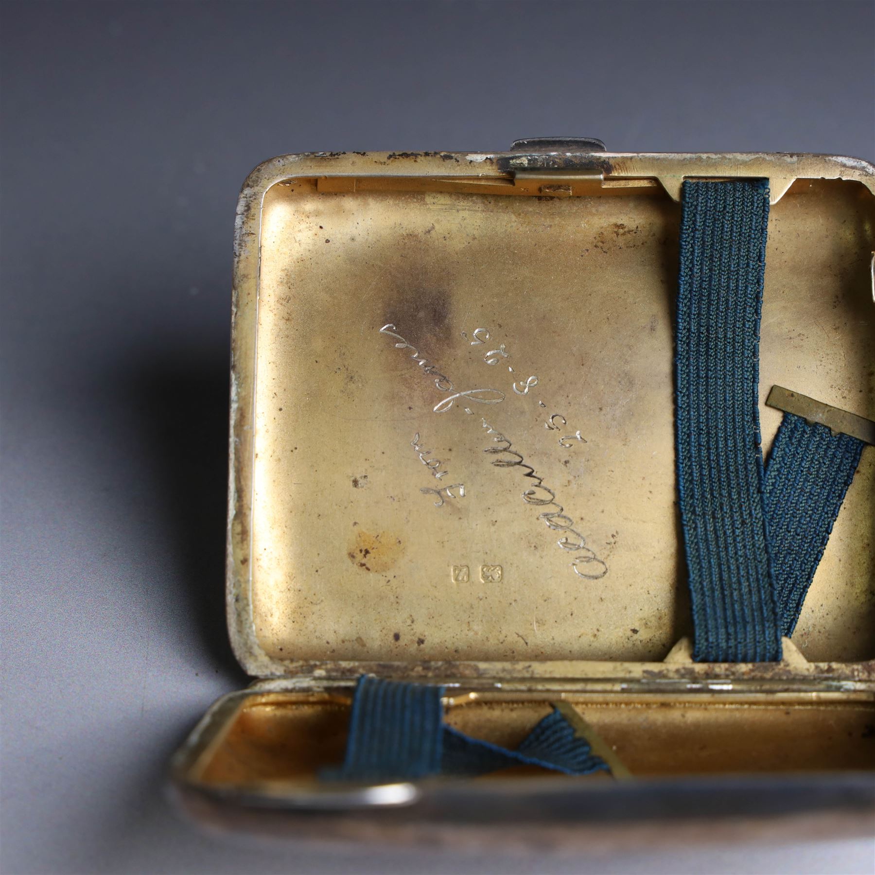 1920s silver cigarette case, with engraved initials and foliate decoration to cover and personal engraving to interior, hallmarked Smith & Bartlam, Birmingham 1924, with a similar silver vesta case, hallmarked, cigarette case H8.5cm