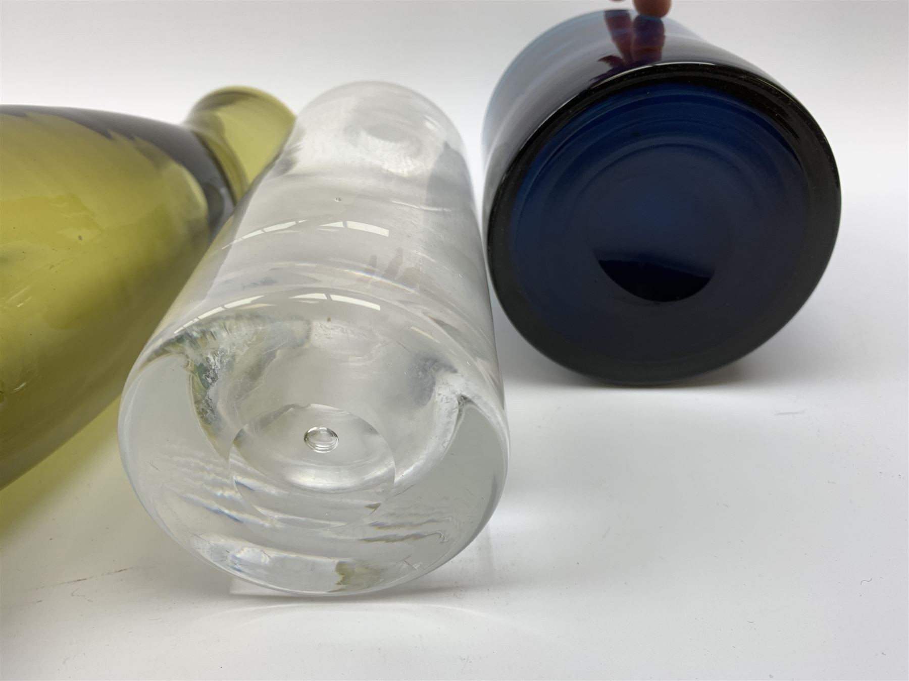 Kosta Boda decanter bottle, c1960, designed by Erik Höglund (1932-1998), in a triangular pressed form, engraved pattern number H1250/250, a clear glass decanter with bubble inclusion, probably Kosta Boda, two Scandinavian glass vases, ochra glass vase, Isle of Wight glass paperweight, Caithness glass paperweight & vase (8)