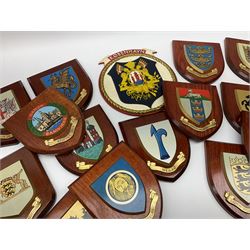 Various European cities and states, wooden heraldic shields each with hand painted raised shield including Baden Wurttemberg, Kunzelsau, City of London, Kingston upon hull etc, seventeen in total. . 