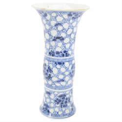 Chinese blue and white vase of cylindrical form, decorated with dragons amongst foliage, together with two other vases 