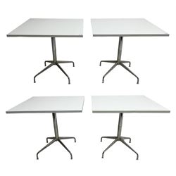 Set four contemporary white finish tables, square top raised on chrome pedestal with quadruped base (4) 