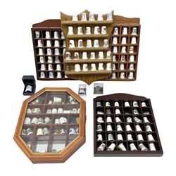 Quantity of thimbles to include ceramic and metal examples, housed in five wood display cases, including one glazed box, together with a quantity of loose and boxed examples