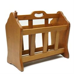 Squirrelman - oak magazine rack, the shaped ends enclosing a central slatted support with carrying aperture, enclosed by slatted sides and base, with carved squirrel signature, by Wilfrid Hutchinson of Husthwaite