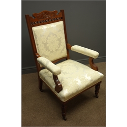  Pair Edwardian walnut framed drawing room arm chairs, carved floral cresting rail, upholstered back seat and arms in damask ivory, turned supports, W65cm  