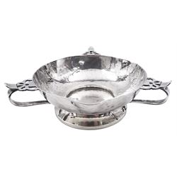 Arts & Crafts silver bowl, the planished bowl of circular form with three lips to rim, and three flower head capped curved handles, upon a circular spreading foot, hallmarked Charles Edwards, London 1904, 5.5cm D13cm, approximate weight 8.81 ozt (274 grams)