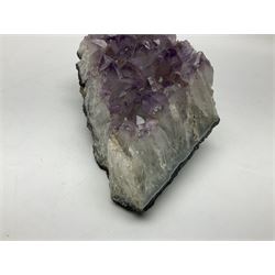 Amethyst crystal geode cluster, with well-defined crystals of various sizes, H10cm, L30cm