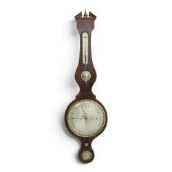 Three mahogany wheel barometers, each with silvered dial, thermometer and hygrometer, two with inlaid decoration, one with architectural pediment and one with swan-neck pediment 