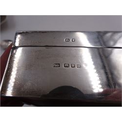 Modern silver mounted cigarette box, of plain rectangular form, with personal engraving to hinged cover, opening to reveal soft wood lined interior, H3.8cm, W21.5cm, hallmarked Padgett & Braham Ltd, London 1967, together with a silver cigarette case, with engraved C scroll decoration, hallmarked Joseph Gloster Ltd, Birmingham 1917 or 1942 and a silver souvenir spoon