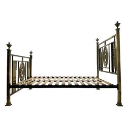 Edwardian brass 4' 6'' double bedstead, the head and footboard with oval cast brass panels decorated with ribbons and foliage, rectangular frame with finials 