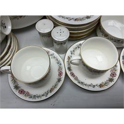 Royal Albert Paragon tea and dinner service for twelve decorated in the Belinda pattern, comprising fourteen saucers, twelve teacups, thirteen side plates, teapot, sauce boat and stand, salt and pepper shakers, two jugs, sucrier, twelve dinner plates, twelve smaller plates, two lidded tureens, twelve bowls, twelve smaller bowls, cake plate, oval plate and oval dish (100)