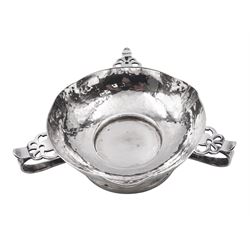 Arts & Crafts silver bowl, the planished bowl of circular form with three lips to rim, and three flower head capped curved handles, upon a circular spreading foot, hallmarked Charles Edwards, London 1904, 5.5cm D13cm, approximate weight 8.81 ozt (274 grams)