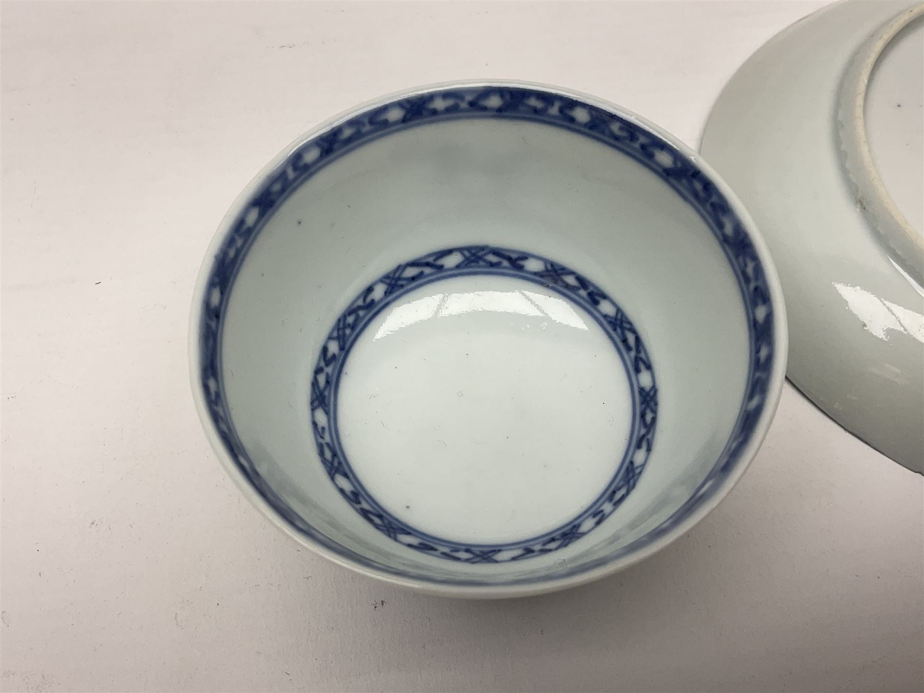 Chinese Nanking Cargo tea bowl and saucer, each decorated with pin tree, saucer with Christie's lot label beneath, tea bowl D7.5cm, saucer D11.5cm