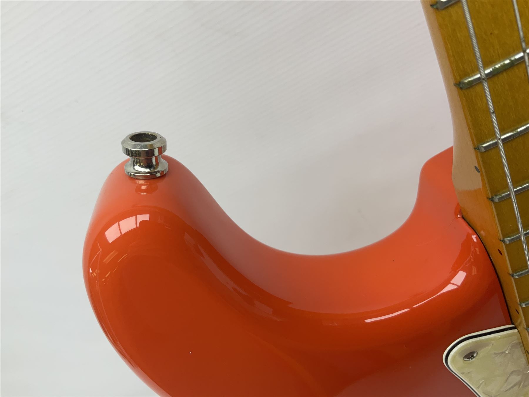 Japanese Squier Fender 'Hank Marvin' Stratocaster electric guitar, c1992, in Fiesta red with tremolo arm and facsimile signature decal; serial no.L037281, L98cm; in hard carrying case.