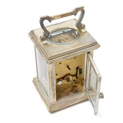 20th century- Silver plated miniature carriage clock in an anglaise case with an enamel dial, Roman numerals, minute track and pieced steel hands, with an oval viewing glass to the lever platform escapement.