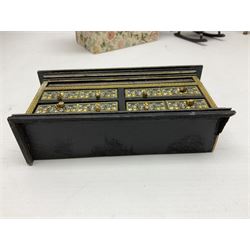 Collection of miniature dolls house furniture, to include five drawer chest painted with blossom, cream and gilt double door mirrored wardrobe, four piece lacquered style desk set, three piece suite, writing desk, wash stand, Knoll style sofa etc (14)