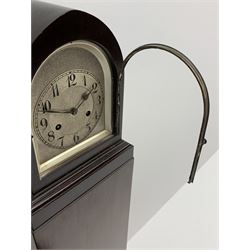 Early 20th century grandmother clock in walnut finish case, lancet shaped top with silvered dial and Arabic chapter ring, twin train driven 'Junghans' movement striking the hours and half on coil