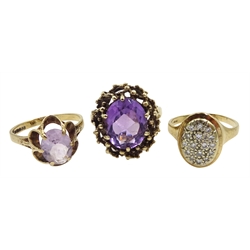Two gold amethyst set rings and a gold diamond set oval ring, all hallmarked 9ct