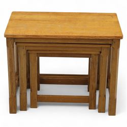David 'Oakleafman' Langstaff - oak nest of three tables, each with a rectangular adzed top, with signature leaf motif on the bottom stretcher, from the workshop of David Langstaff, Easingwold, Yorkshire
