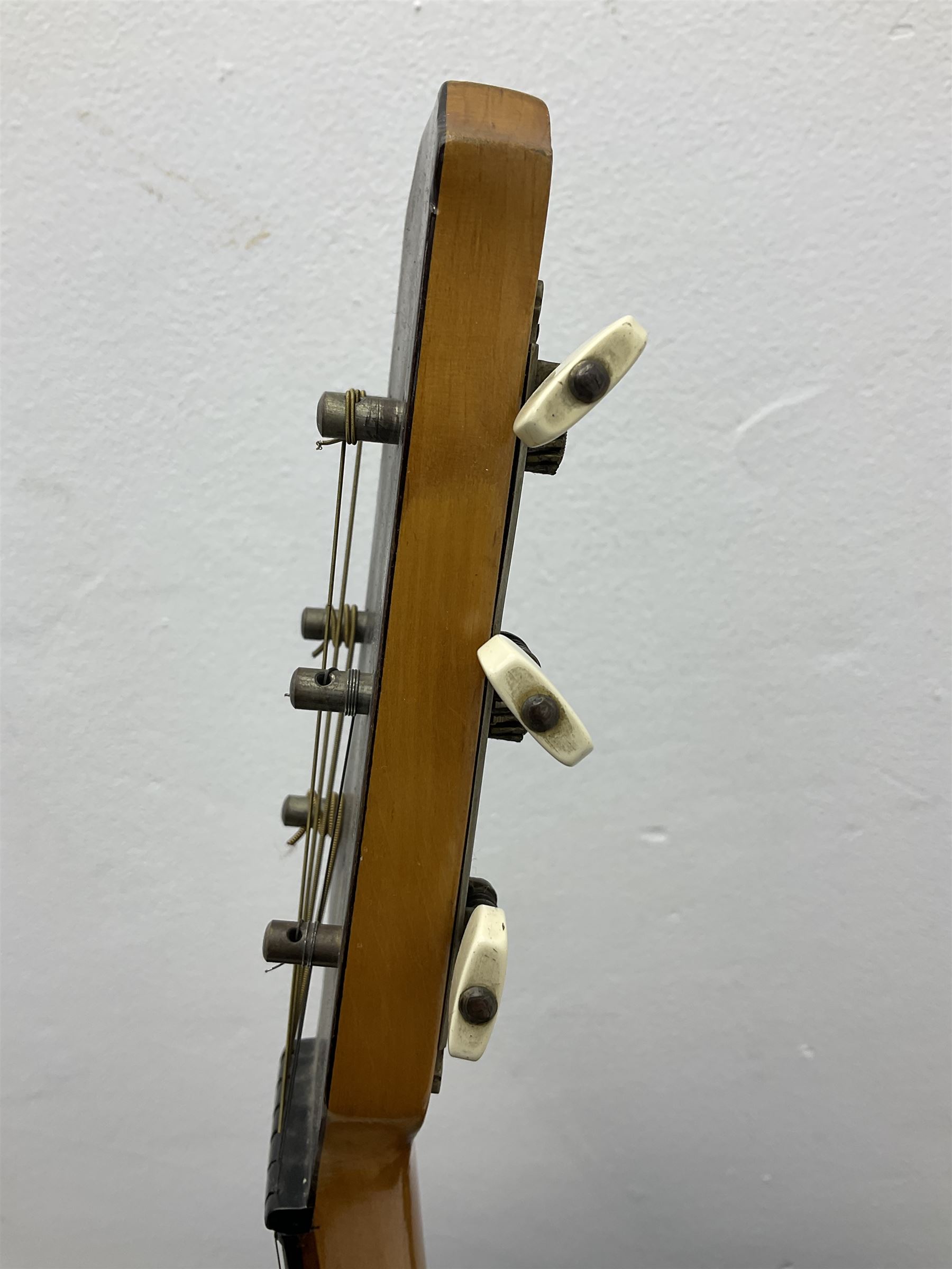 1950s acoustic guitar with f-holes and pickguard L105cm; black fur lined hard carrying case