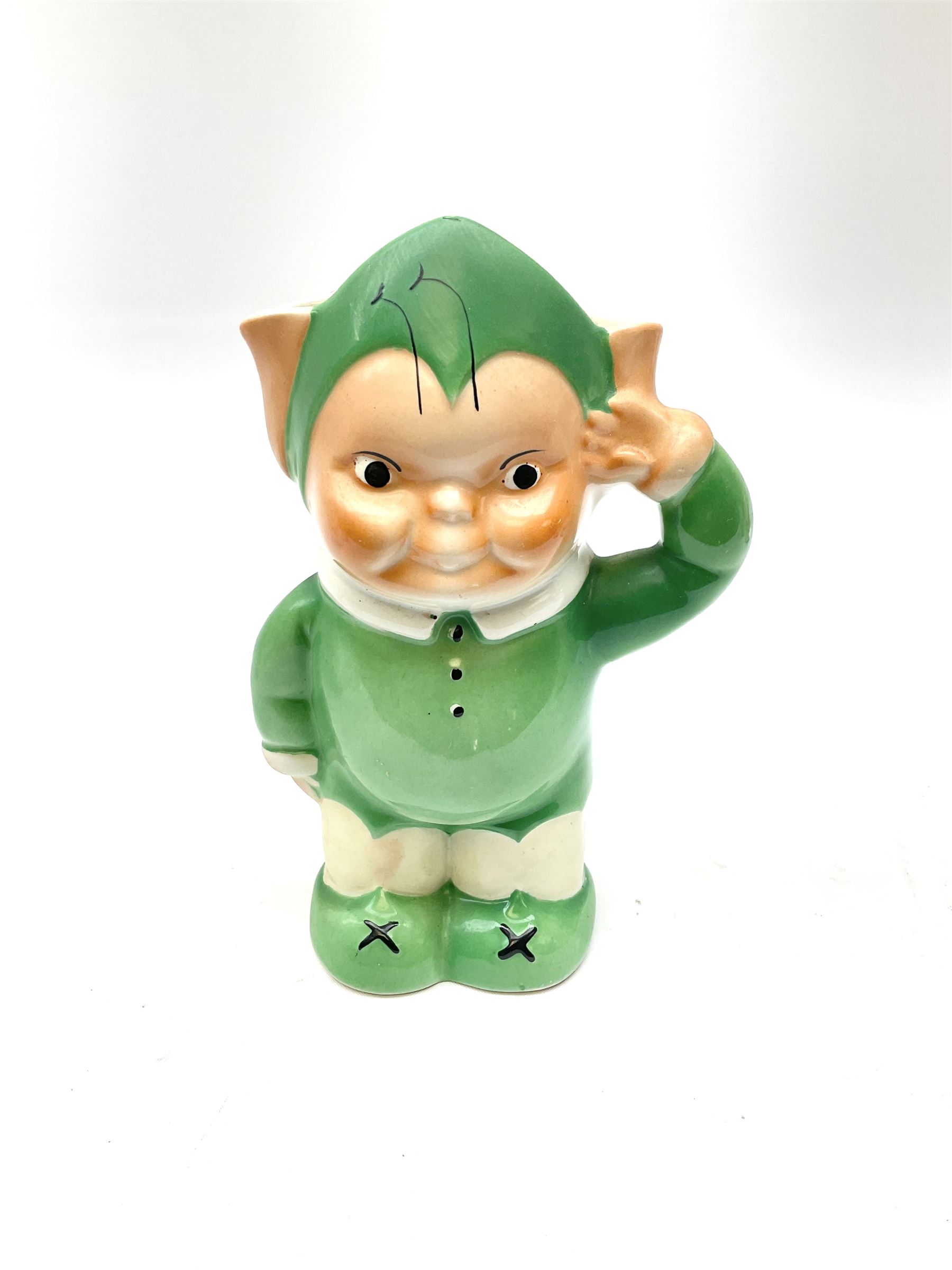 Shelley Boo Boo three piece tea set designed by Mabel Lucie Attwell, comprising teapot modelled as a house, sugar bowl modelled as a toadstool, and creamer modelled as an elf, each with printed marks beneath, together with a Shelley Mabel Lucie Attwell teacup and saucer. 