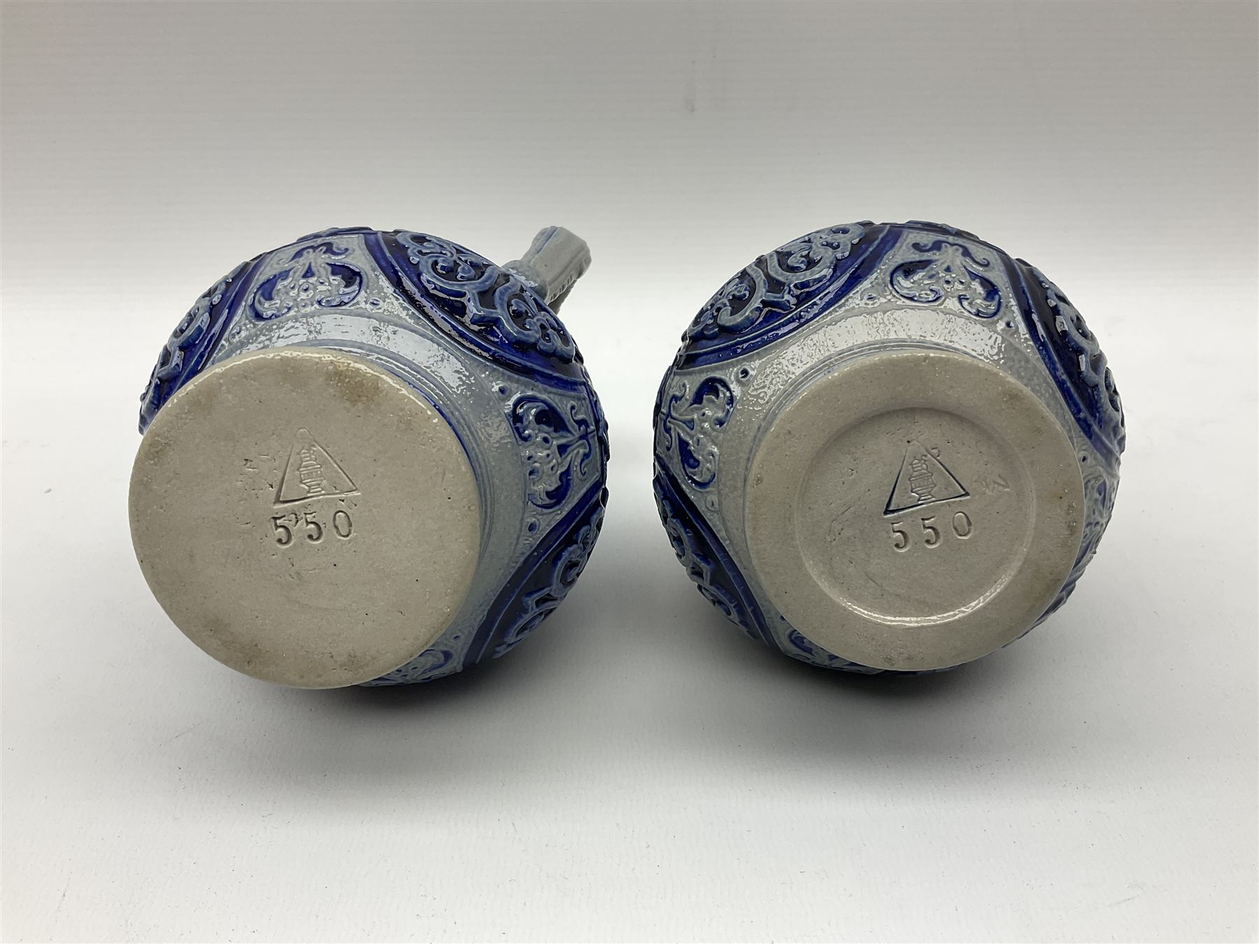 Pair of late 19th Century German Simon Peter Gerz salt glaze stone jugs, impressed mark to base, model number 550, H15cm