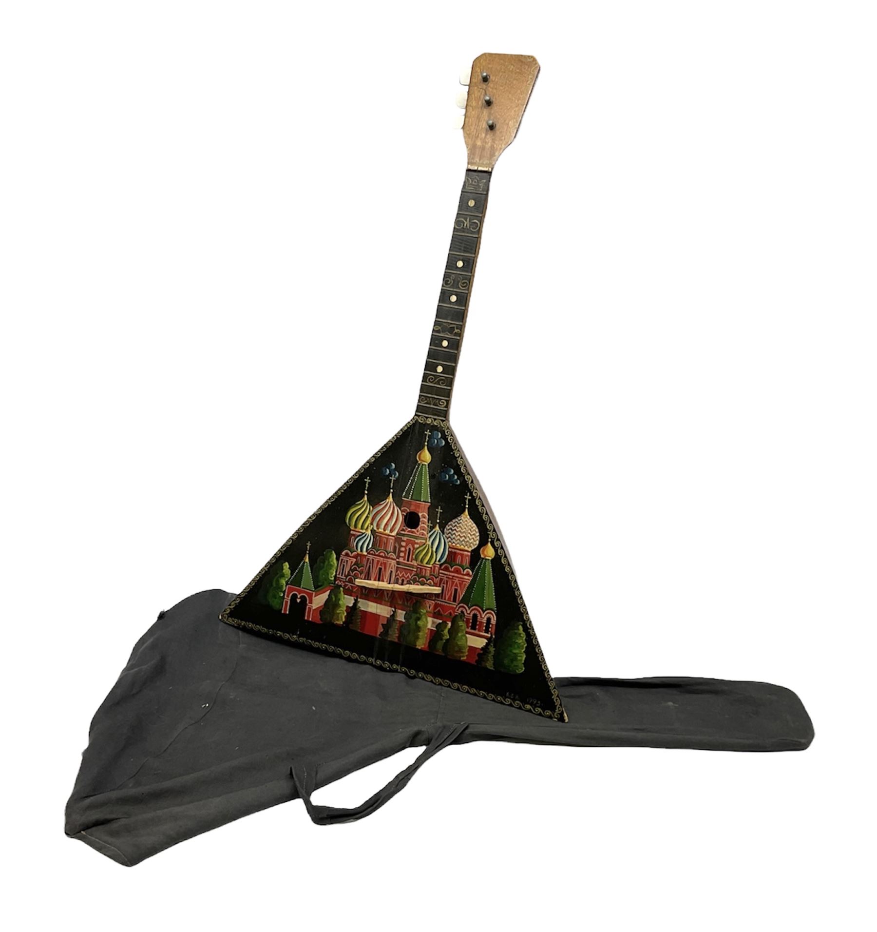 Russian balalaika with six-piece segmented back, the top painted with a scene of Russian onion capped buildings monogrammed K.B.H.1993; bears cyrillic label; L67.5cm; in carrying bag