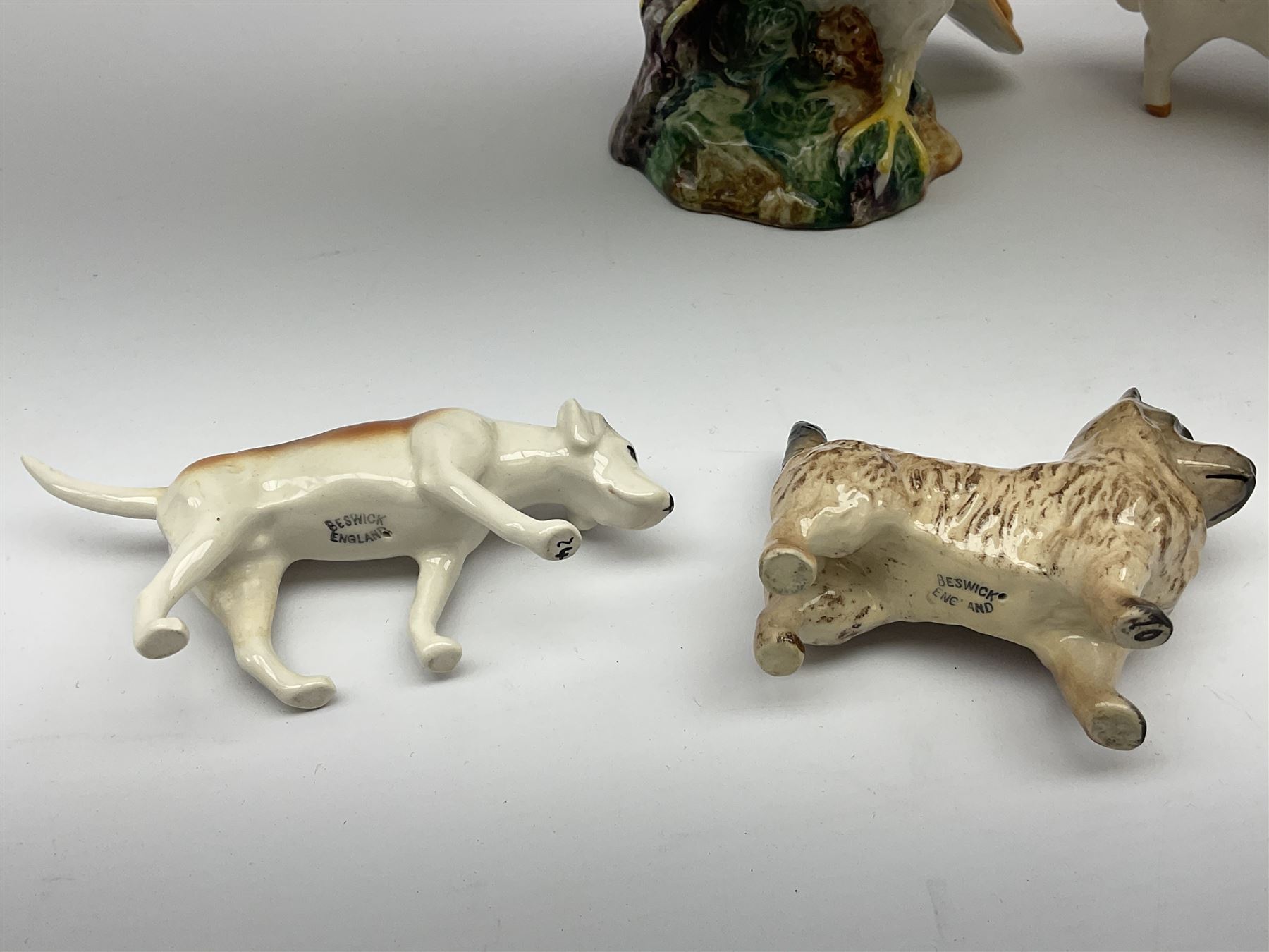 A group of Beswick figures, comprising Barn Owl 1046, various small dog figures including Yorkshire Terrier, Cairn Terrier, Dalmatian, Beagles, Pug, etc., CH Wall Champion Boy 53 pig, fox, donkey, horse, and foal. 