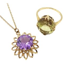 Gold circular amethyst pendant necklace and a gold citrine ring, both 9ct