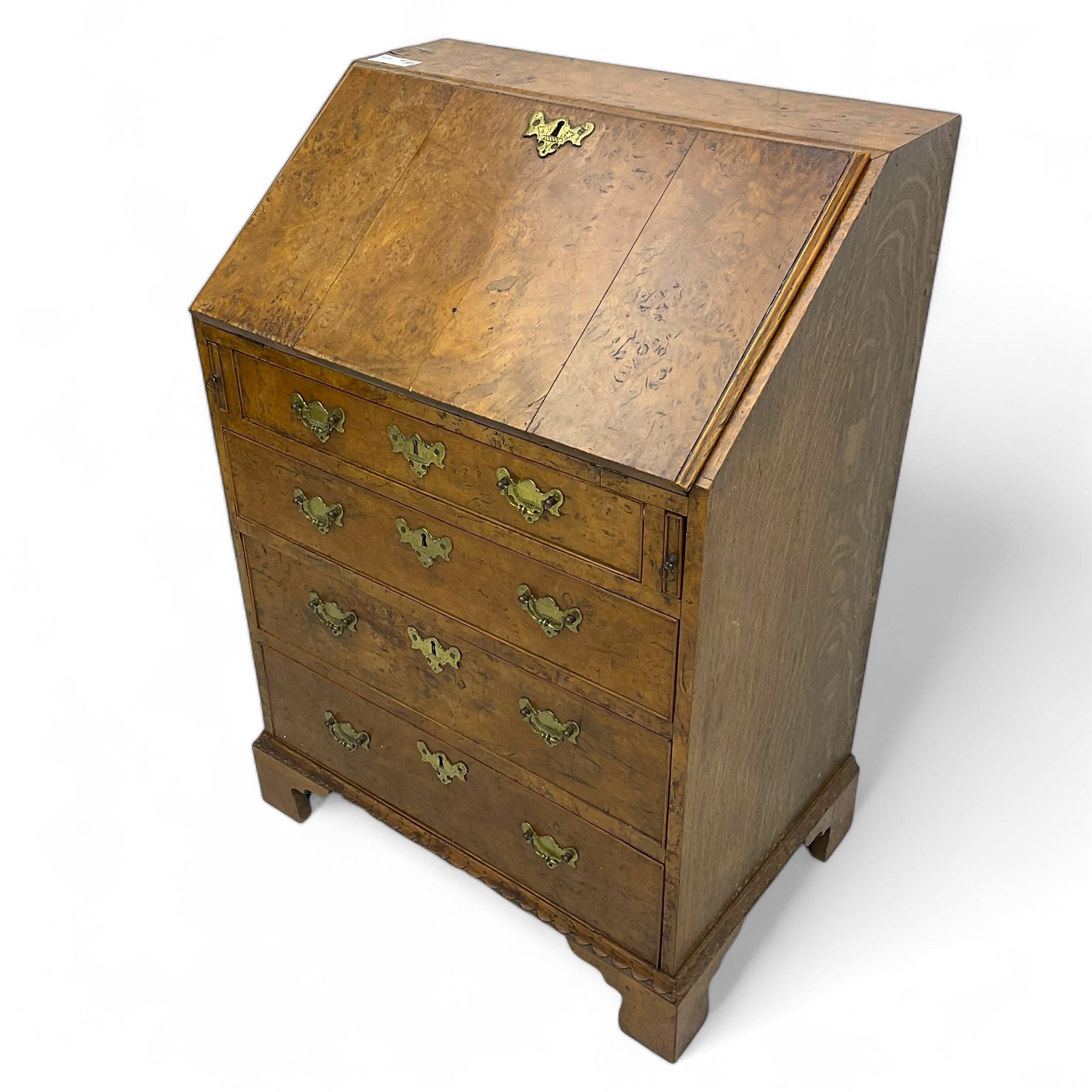 George III figured walnut bureau, fall-front enclosing central cupboard, six pigeonholes and six drawers, fitted with four graduated cockbeaded drawers, on bracket feet