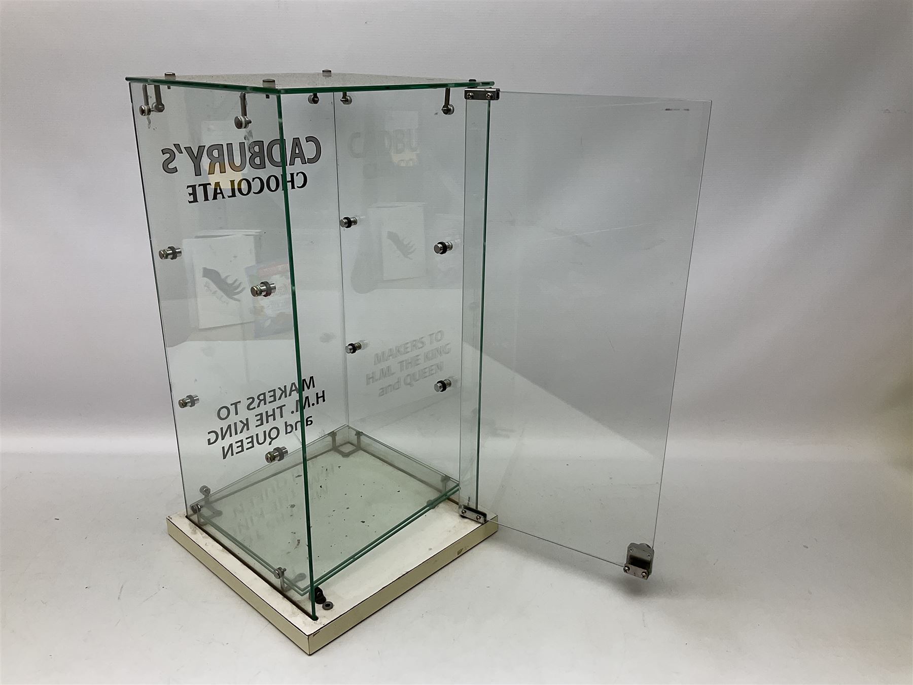 Cadbury's chocolate countertop display advertising cabinet, glazed with 'Cadbury's Makers to T.M The King & Queen', with two glass shelves and a back opening door, H54,5cm