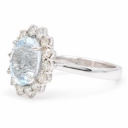 18ct white gold aquamarine and diamond cluster ring, single oval cut aquamarine of approx 2.80 carat, surrounded by fourteen round brilliant cut diamonds, hallmarked, total diamond weight approx 0.60 carat