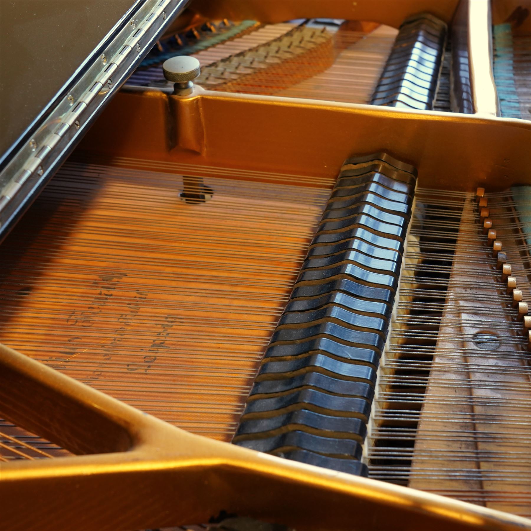 Feurich of Leipzig - German overstrung medium grand piano in a black lacquered case, with a seven octave M&K of Leipzig roller action keyboard, original strings and tuning pins, new hammer heads and dampers, with sostenuto and sustain pedals, adjustable music desk and matching adjustable stool.