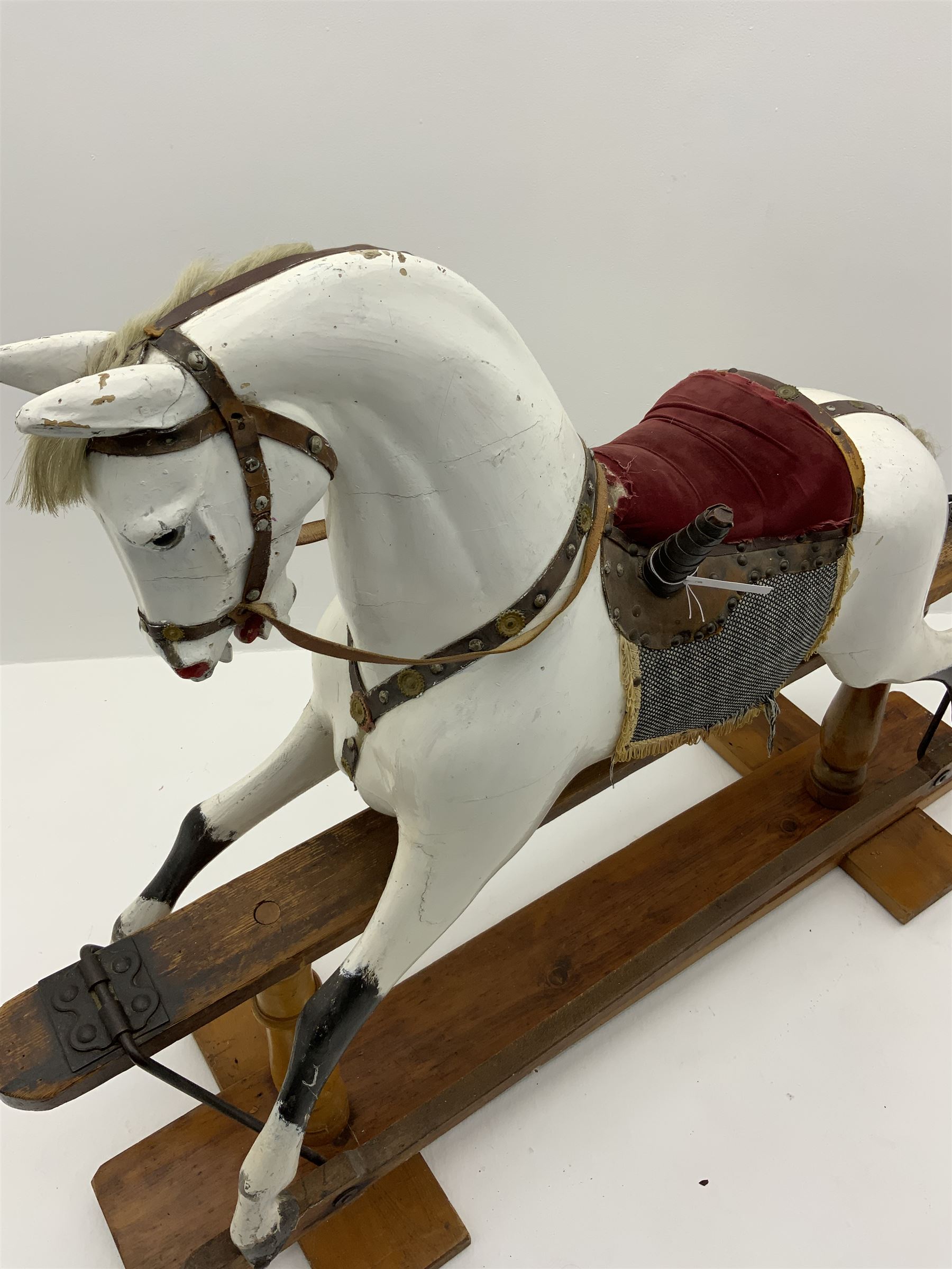 Victorian white finished rocking horse, complete with studded saddle and bridle, brass stirrups