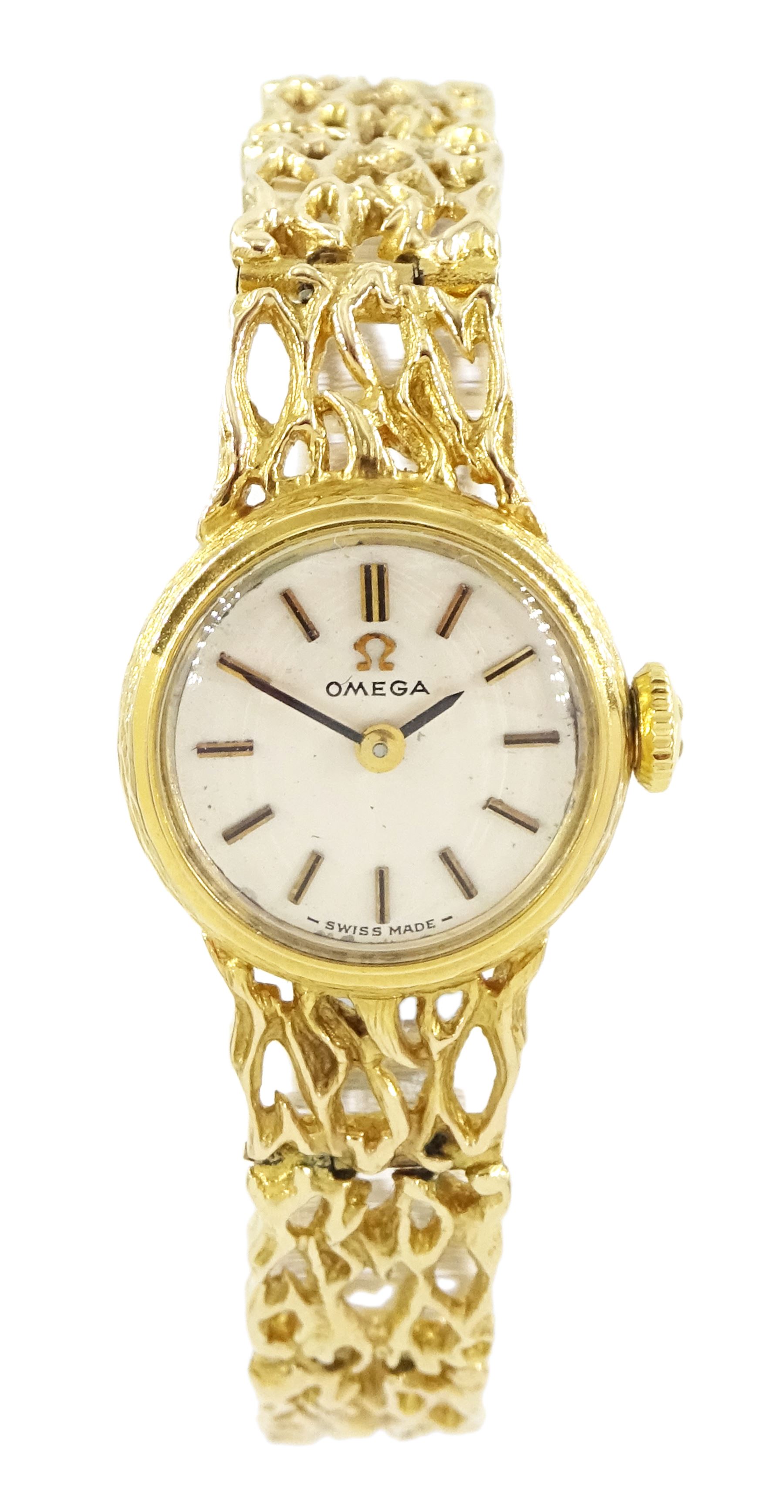 Omega ladies 9ct gold manual wind wristwatch, Ref. 7115674, silvered dial with baton hour markers, on 9ct gold pierced design bracelet, London 1972, with guarantee dated 1973